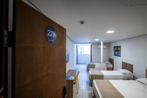 Postel nebo postele na pokoji v ubytování Bessa Beach Hotel
