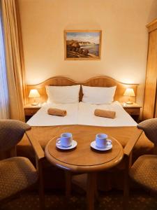 Postel nebo postele na pokoji v ubytování Hotel Polaris