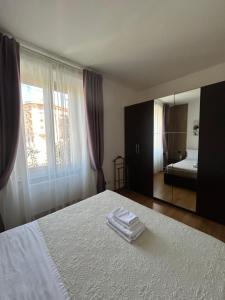 En eller flere senge i et værelse på Appartamento Alba