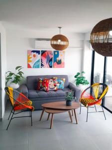 a living room with a couch and two chairs at Cosy Mountain View 3BR Apartment, Prime Location! in Floridablanca