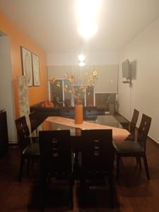 a dining room with a table and chairs and a couch at Depa amueblado y Bonita in Buenavista