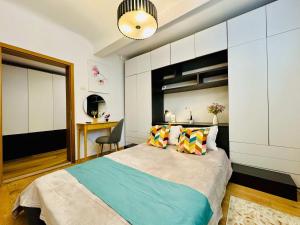 En eller flere senge i et værelse på Joy City Stay Nemoianu 8D