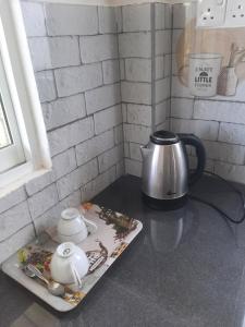 Set per la preparazione di tè e caffè presso Welcome Homestay