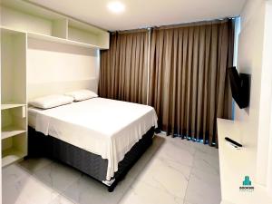 Fortaleza Sul Flats Service客房内的一张或多张床位