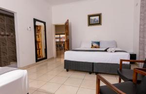 En eller flere senge i et værelse på Mercury House + 70 billeder