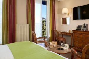 TV a/nebo společenská místnost v ubytování Timhotel Invalides Eiffel