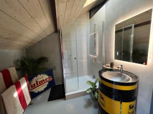 a bathroom with a barrel sink and a shower at Le Garage in Luz-Saint-Sauveur +10 photos
