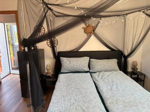 a bedroom with a bed with a canopy at Terra in Valledoria +42 photos