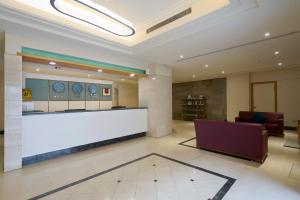 a lobby with a reception desk in a building at 華麗大飯店Ferrary Hotel in Taipei +41 photos