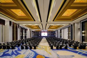 an empty room with tables and chairs in a building at InterContinental Bali Resort by IHG in Jimbaran