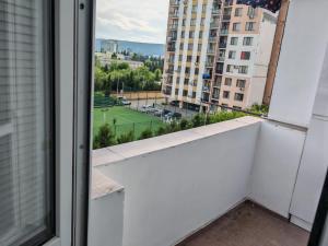 a balcony with a view of a city at Tbilisi LUXURY APARTMENT in Tbilisi City