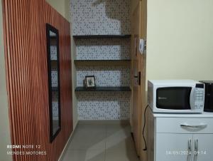 Η κουζίνα ή μικρή κουζίνα στο Kitnet linda 8A +4 φωτογραφίες
