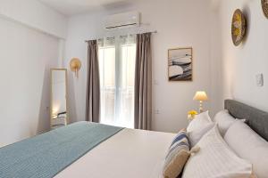 Ένα ή περισσότερα κρεβάτια σε δωμάτιο στο Atop gold luxury suites +22 φωτογραφίες