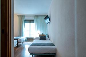 Postel nebo postele na pokoji v ubytování Hotel Alda Guijuelo