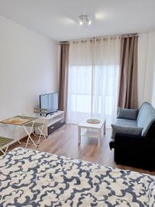 Televízia a/alebo spoločenská miestnosť v ubytovaní Alisio 51 Playa de las Canteras