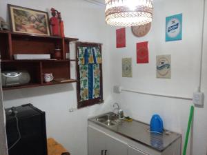 a kitchen with a sink and a mirror at Mikasa in La Porteña