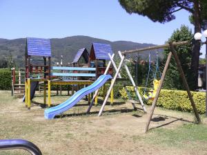 a playground with a blue and yellow slide at Bungalow 477 Colibrì in Ameglia