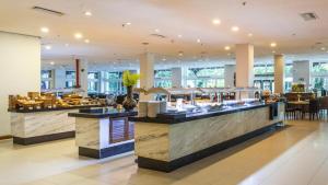 a restaurant with two counters with food on display at Costa do Sauípe Resorts in Mata de Sao Joao