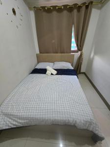 Postel nebo postele na pokoji v ubytování Sojourn in S Residences