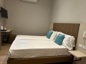 Postel nebo postele na pokoji v ubytování Hotel Giappone