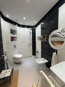 a bathroom with a toilet and a sink and a shower at Sea View Apartment in Mirleft +16 photos