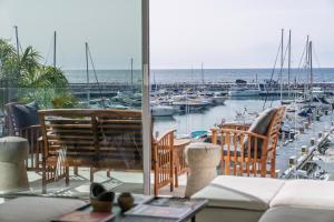a view of a marina with boats in the water at 243-Fully Renovated-Puerto Banus Marbella Front Line Penthouse in Marbella