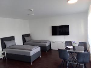 Postel nebo postele na pokoji v ubytování Apartment Metzingen City