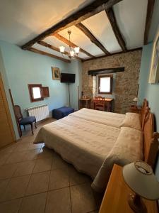 a bedroom with a large bed in a room at Posada Soano in Soano