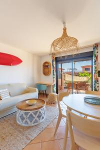 a living room with a couch and a table at Alma Ventura - A Peaceful Getaway in Majanicho in Majanicho