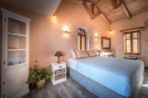 a bedroom with a large bed and a window at Luxury Zakynthos Villa Villa Leona 2 Bedrooms Agios Nikolaos in Zakynthos Town