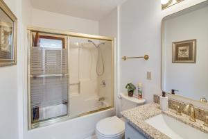 a bathroom with a shower and a toilet and a sink at Walk to Marina Water-View Dale Hollow Lake Escape in Celina +25 photos