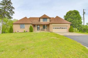 a house with a large yard with a driveway at Walk to Marina Water-View Dale Hollow Lake Escape in Celina