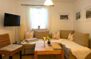 Un televizor și/sau centru de divertisment la Ferienhäusel am Malerweg mit Terrasse