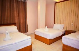 Voodi või voodid majutusasutuse Grand Golden Pyramids View Hotel toas
