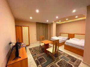 Postel nebo postele na pokoji v ubytování Grand Golden Pyramids View Hotel