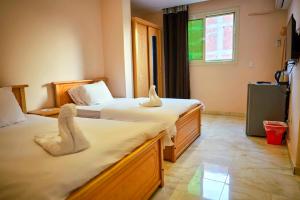 Voodi või voodid majutusasutuse Grand Golden Pyramids View Hotel toas