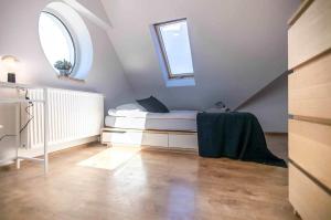 En eller flere senge i et værelse på Pokoje minutka do Monciaka