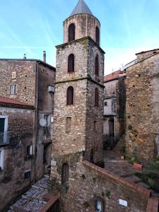 an old building with a tower on top of it at Casa Vacanze Centro Storico in Centola