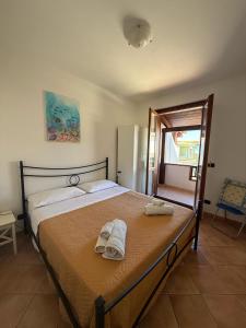Postel nebo postele na pokoji v ubytování L'Ancora Blu