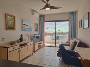 A television and/or entertainment centre at Casa Iguazu - At the center of Playa del Inglés