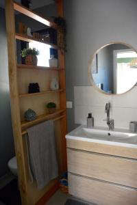 a bathroom with a sink and a mirror at Le Bonheur à Ventoux in Saint-Pierre-de-Vassols