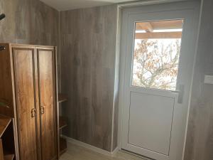a room with a door and a window in it at Privát Nikodém in Veľký Slavkov