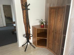 a room with a pole next to a wooden cabinet at Privát Nikodém in Veľký Slavkov