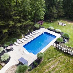 an overhead view of a swimming pool in a yard at Fallswood Lodge - by The Chalets in Logan