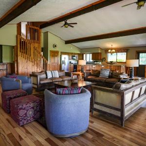 a large living room with couches and a table at Grande Butte Lodge - by The Chalets in Laurelville +31 photos