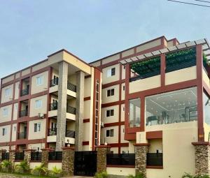a large apartment building with a large window at Kan's Krib in Accra
