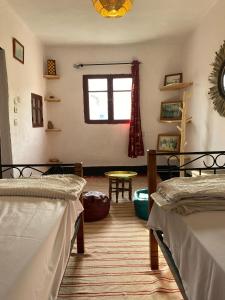 Postel nebo postele na pokoji v ubytování Downtown Hostel