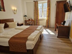 Postel nebo postele na pokoji v ubytování Hotel Königin Olga