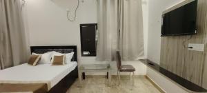 Postel nebo postele na pokoji v ubytování Hotel keptown