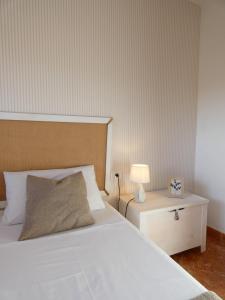 A bed or beds in a room at VV El Picón